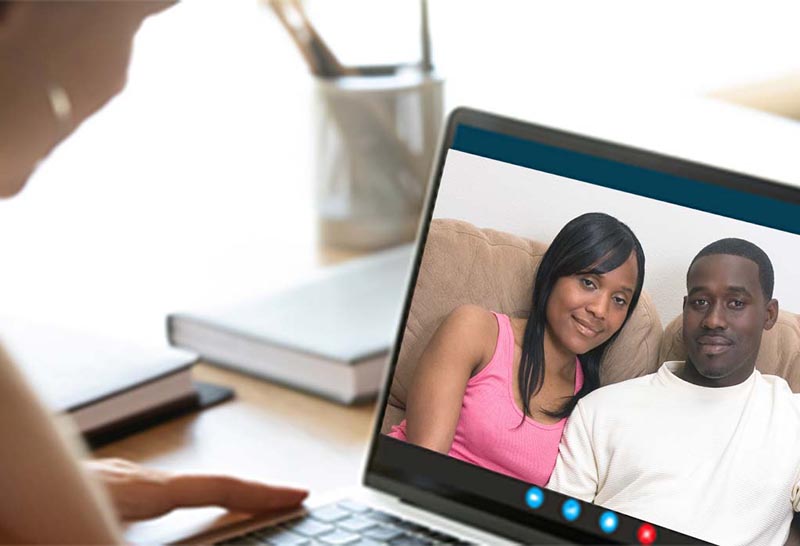 couple on laptop in online session with counselling therapist